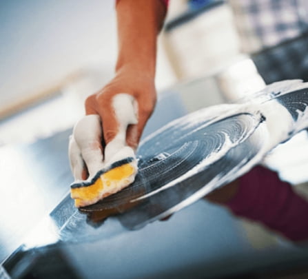 Person washing a kitchen surface
