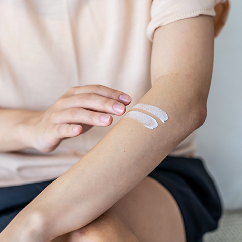 Person applying emollient